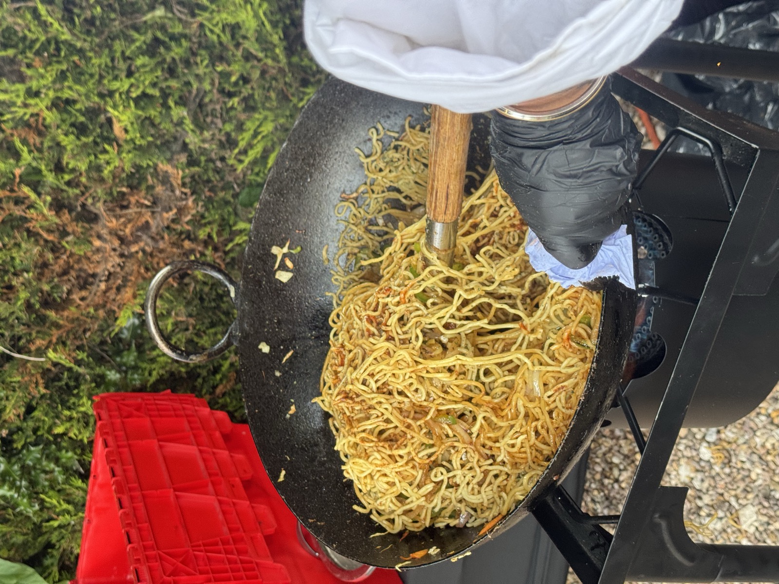 Live wok cooking at a Bunchi event